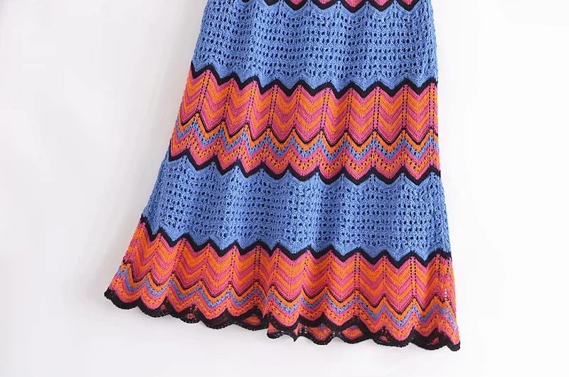 Colorful crocheted skirt with zigzag pattern on a white background
