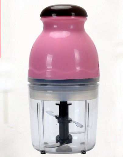 Pink kitchen chopper with vegetables on a white background