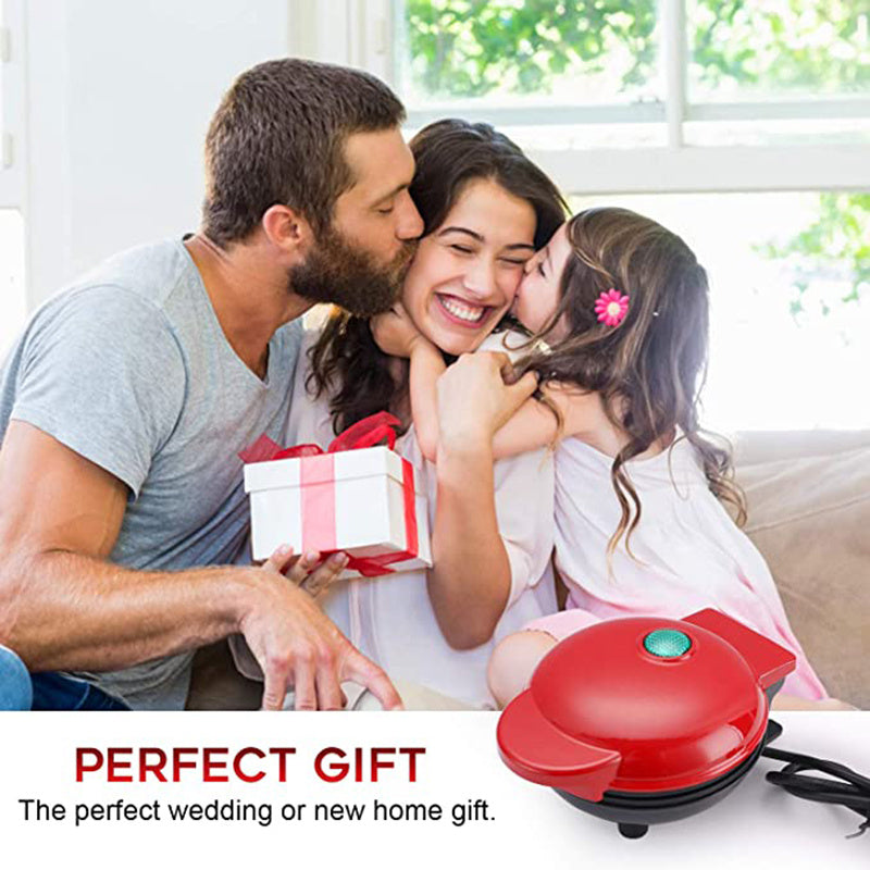 Family with a gift and a red appliance on a white background