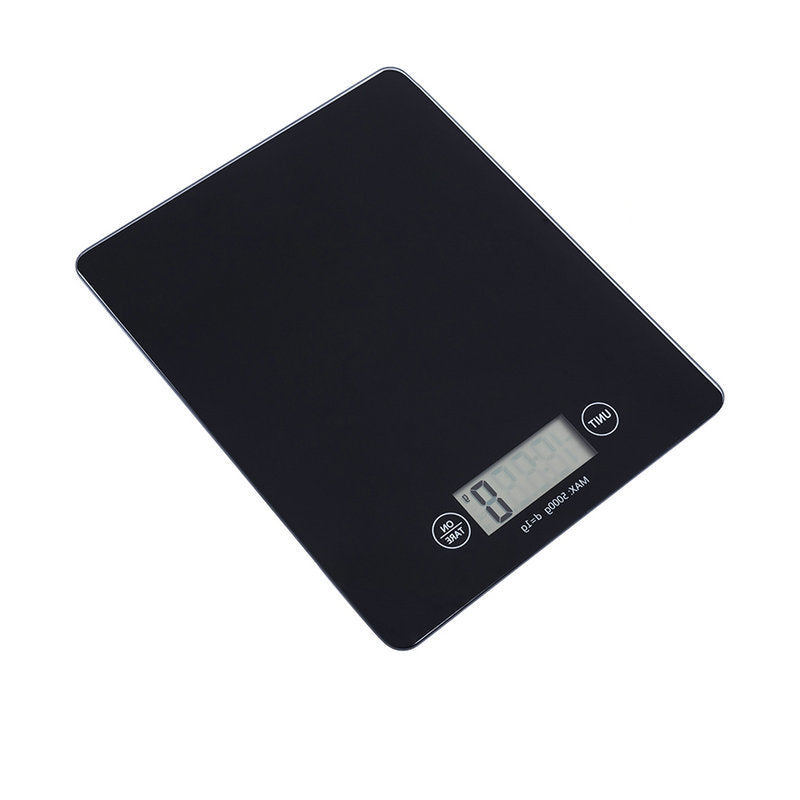 Black digital kitchen scale on a white background