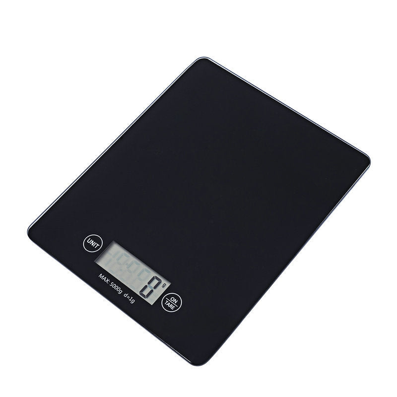 Black digital kitchen scale on a white background