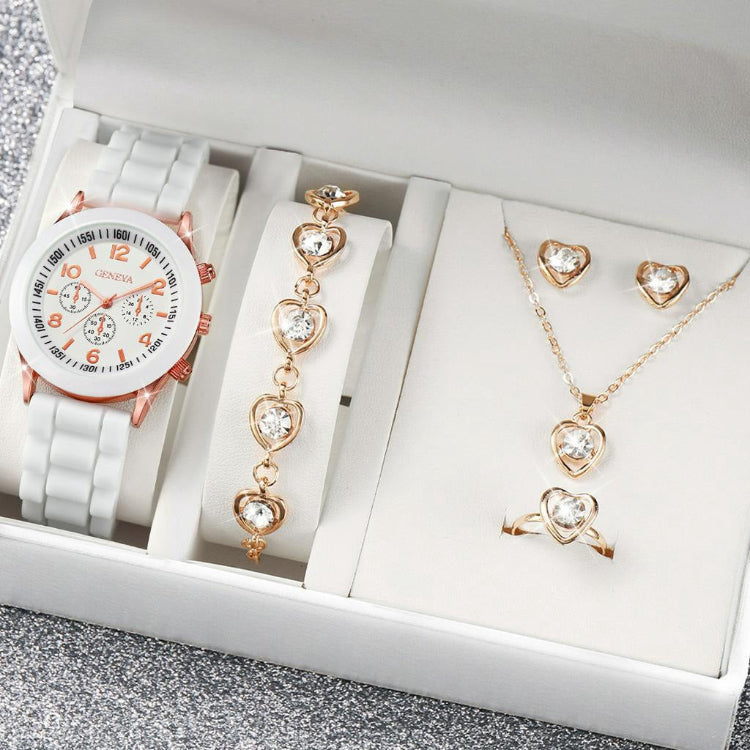 Jewelry set including a watch, bracelet, necklace, and ring in a box.