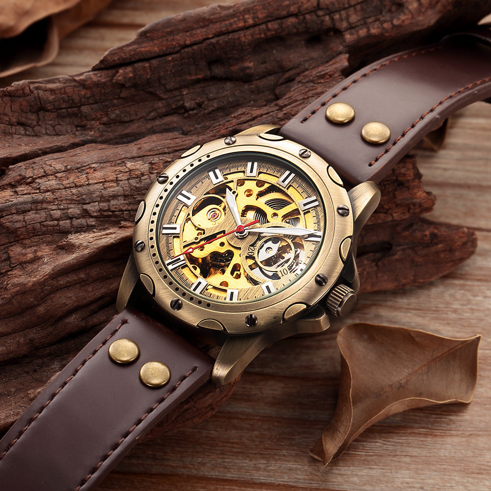 Vintage-style watch with brown leather strap on wooden surface