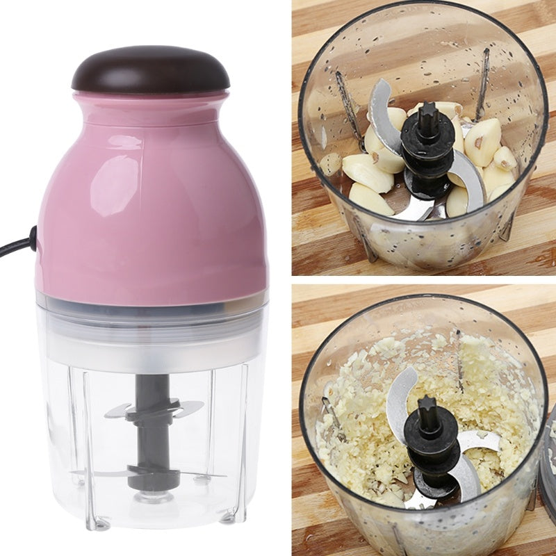 Pink hand blender with food processor attachment on a white background