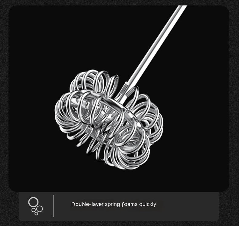 Metallic whisk with double-layer spring on a black background
