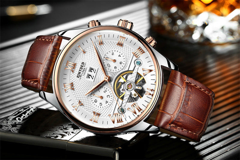 Luxury watch with brown leather strap on a reflective surface