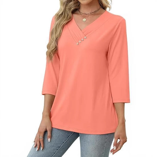 Coral long-sleeve top worn by a person on a white background