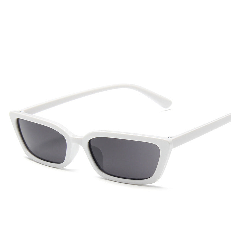 White sunglasses with dark lenses on a white background