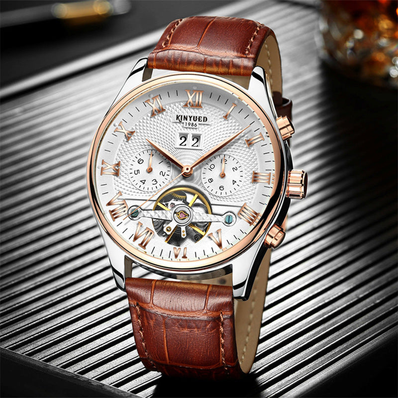 Luxury watch with brown leather strap on a reflective surface