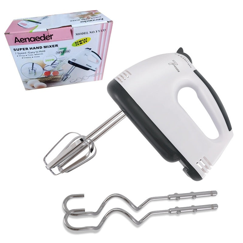 Hand mixer with attachments and packaging on a white background