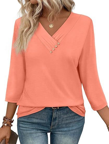 Coral long-sleeve top worn by a person on a white background