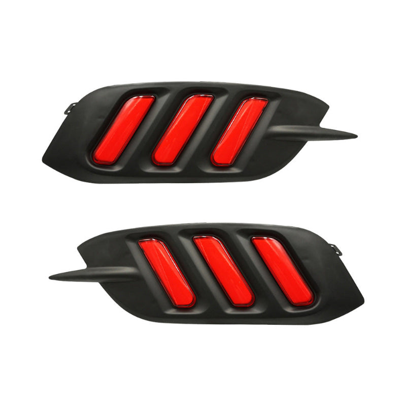 Two black car grille inserts with red accents on a white background