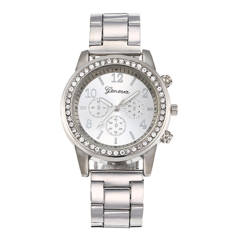 Silver quartz wristwatch with rhinestone bezel and light dial on metal link bracelet