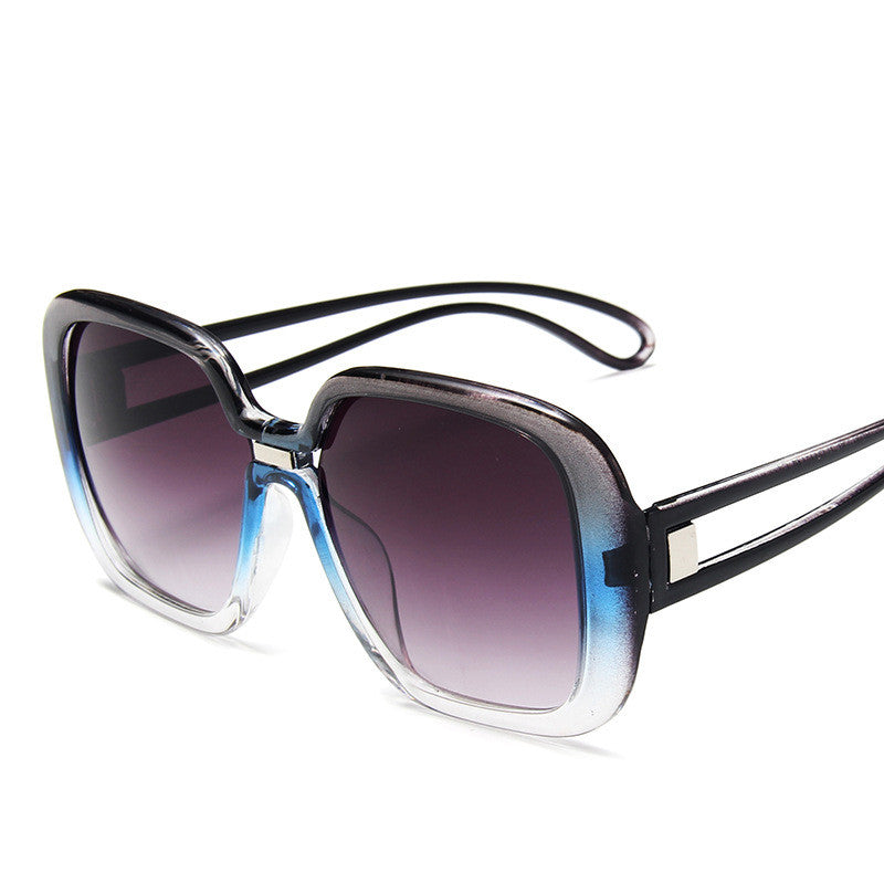 Sunglasses with black frame and gradient lenses on a white background