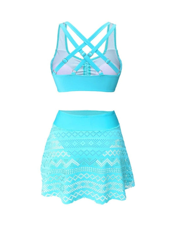 Blue sports bra and skirt set on a white background