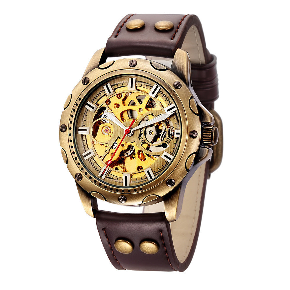 Watch with gold case and brown leather strap on a white background