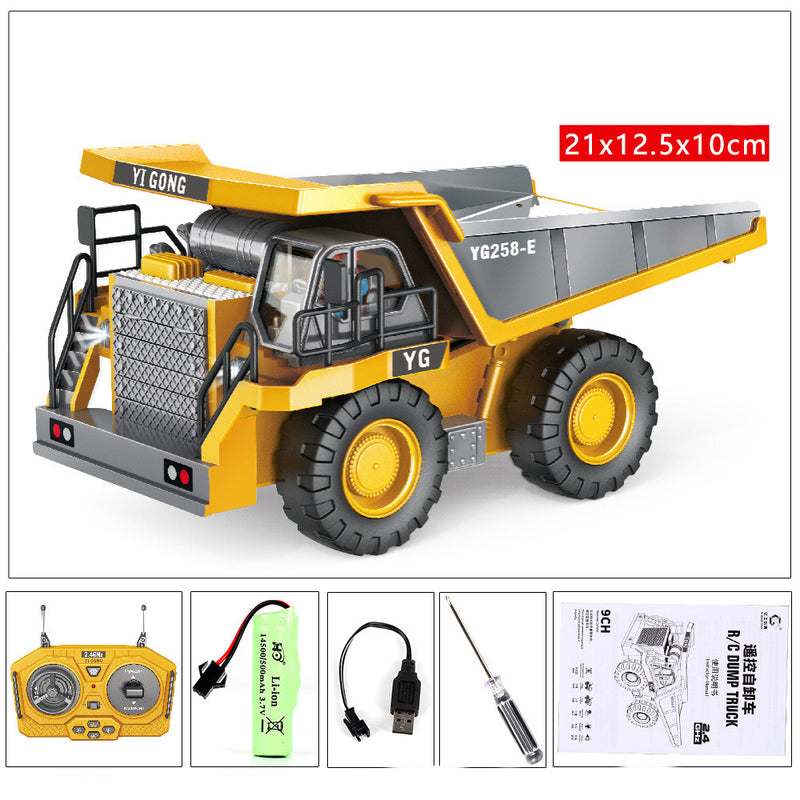 Yellow RC construction dump truck toy with front scoop, cab, and large wheel tires