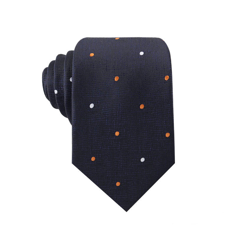 Navy blue tie with orange and white polka dots on a white background