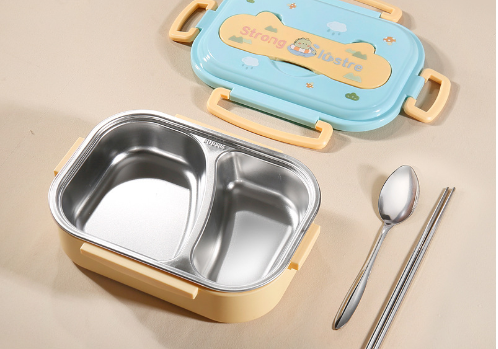 Yellow lunch box with blue lid, stainless steel two-compartment interior, spoon, and chopsticks