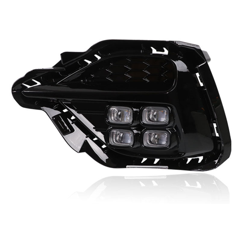 Black car headlight on a white background