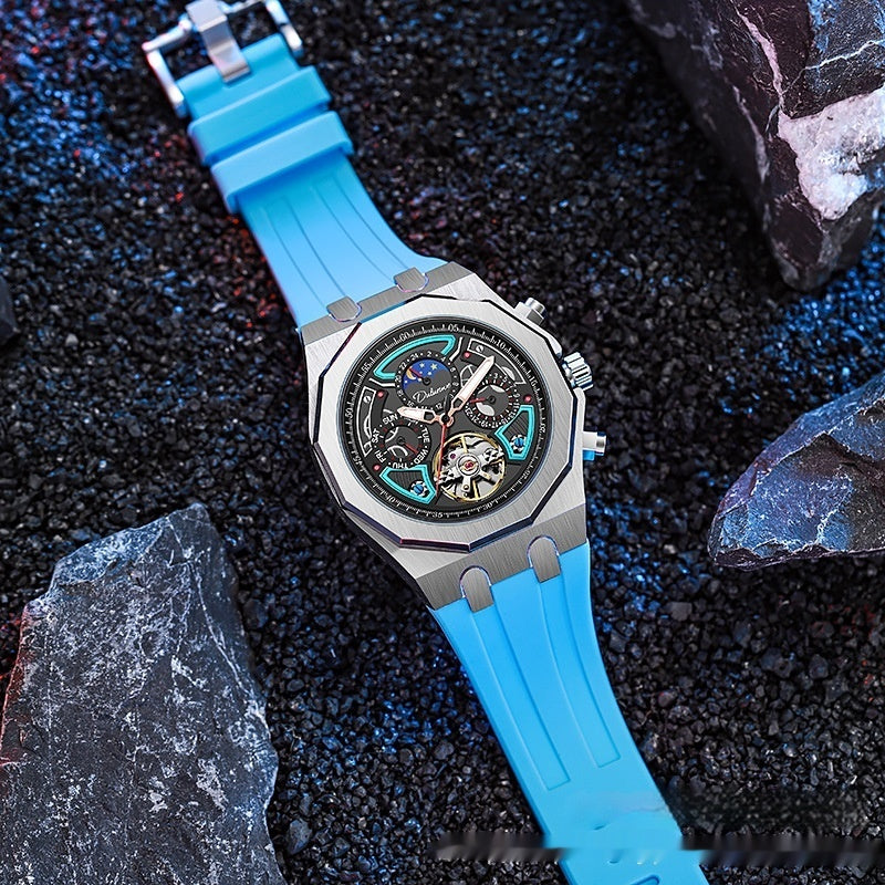 Watch with blue strap on a dark textured surface