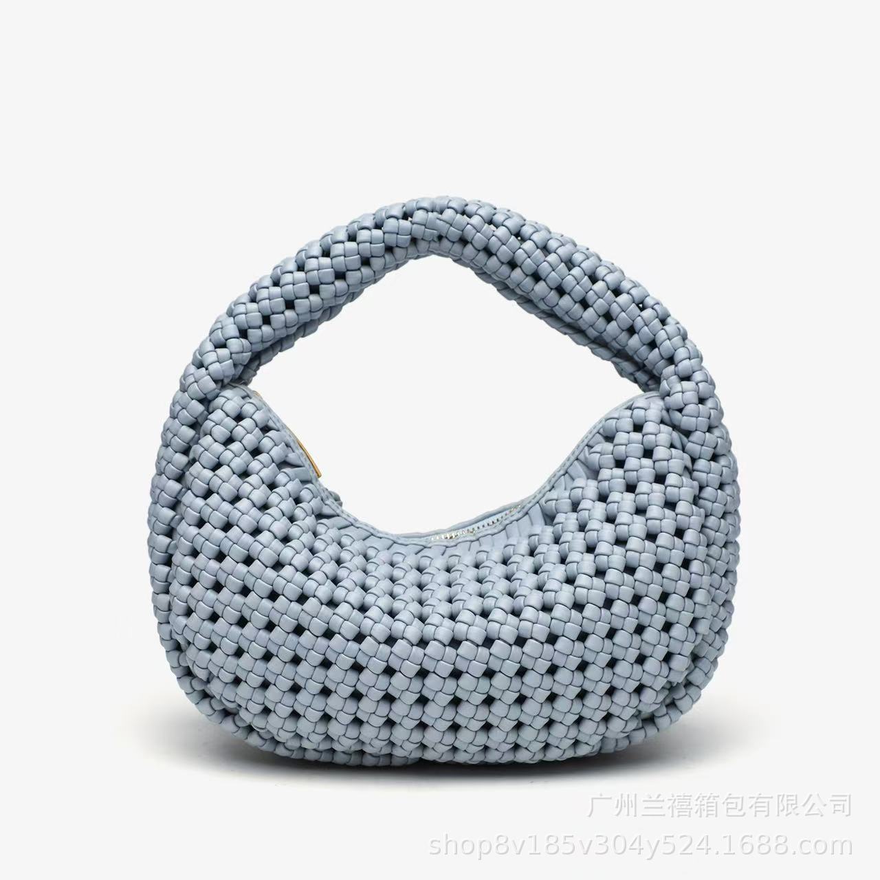 Blue woven handbag on a white background