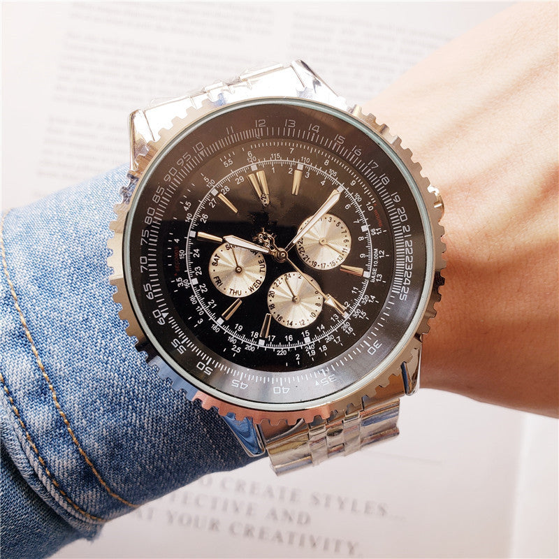 Luxury watch with detailed face on a wrist wearing denim jeans