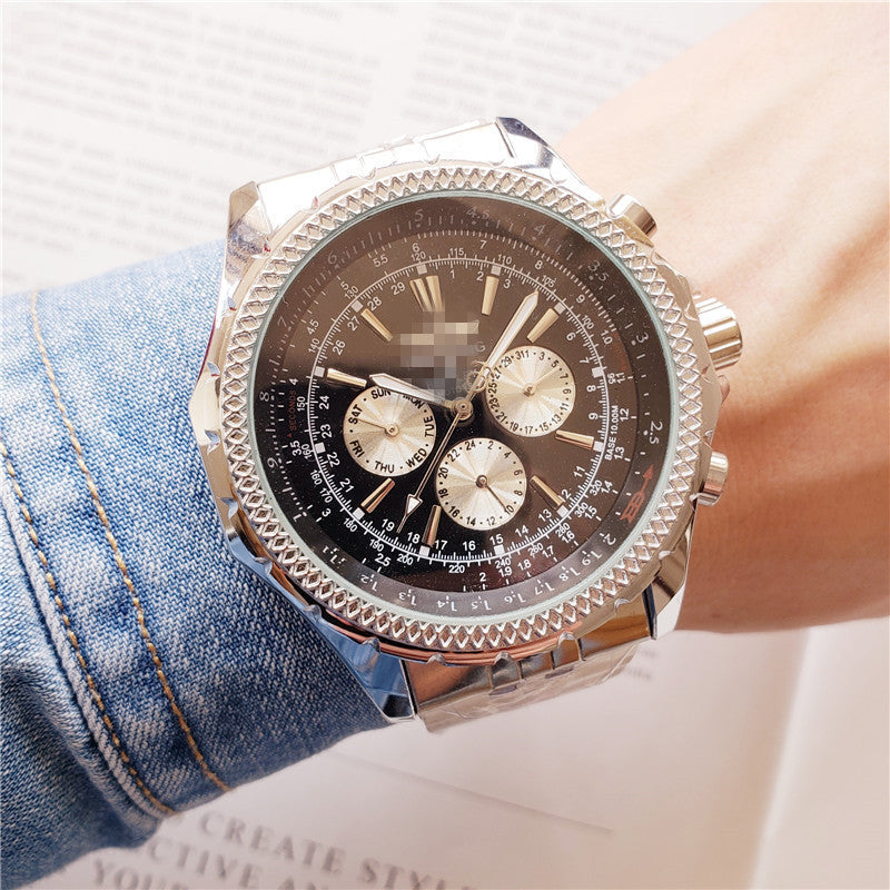 Luxury watch on a person's wrist with denim sleeve