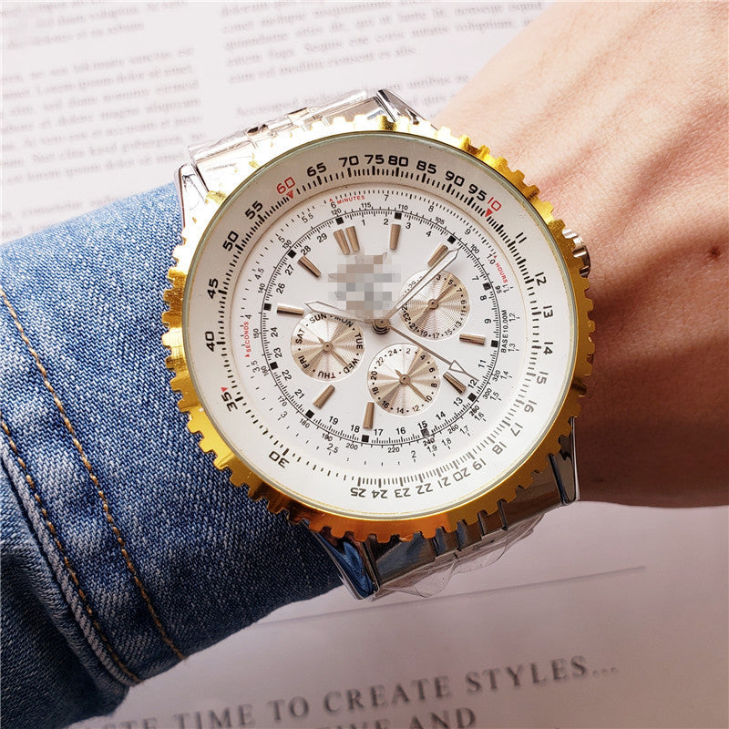 Close-up of a person wearing a gold wristwatch with a detailed face.