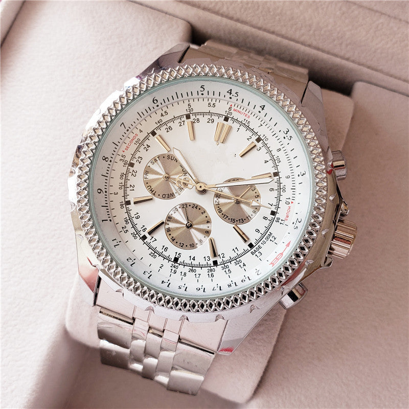 Luxury watch with detailed face and metal strap on a soft pink background