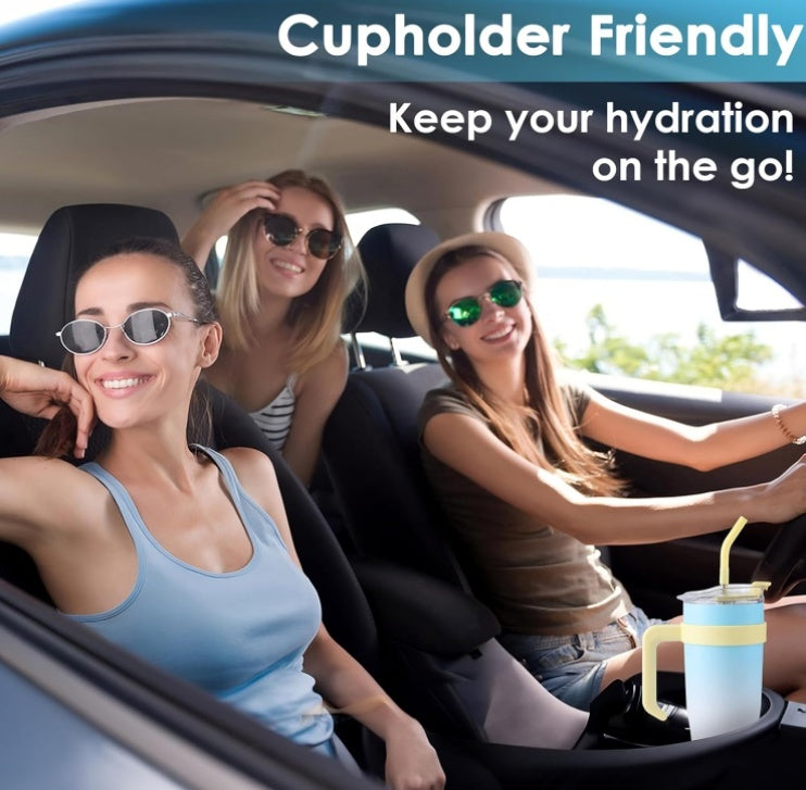 Three women in a car with a cupholder friendly product, featuring a blue cup with a straw.