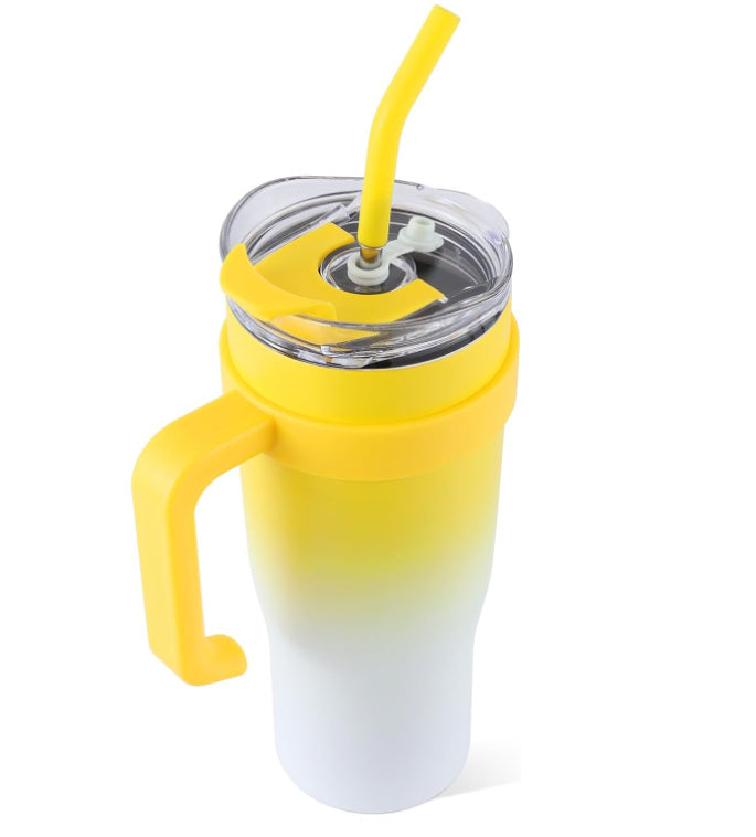 Gradient yellow to white tumbler with a straw on a white background