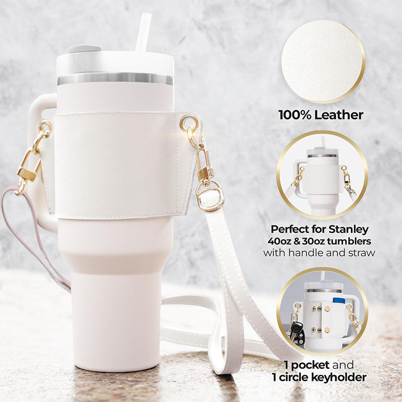 White leather tumbler holder with keychain on a marble surface