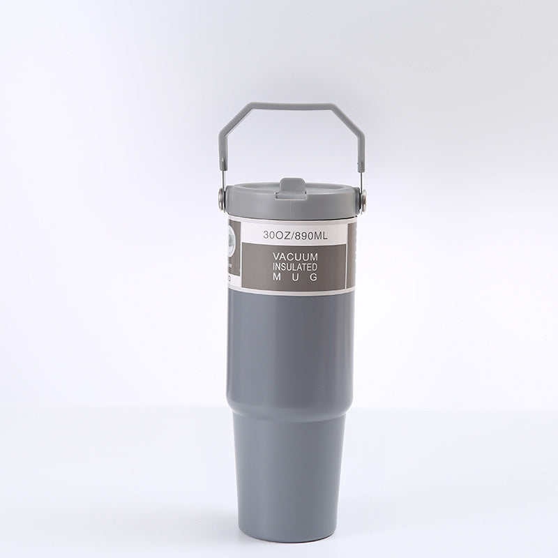 Gray vacuum insulated mug with handle on a white background