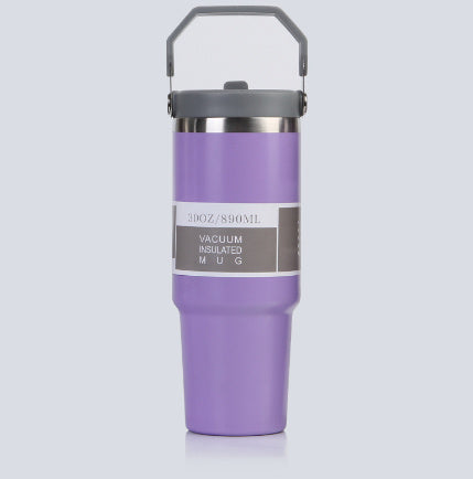 Purple vacuum insulated mug with gray handle on a light gray background
