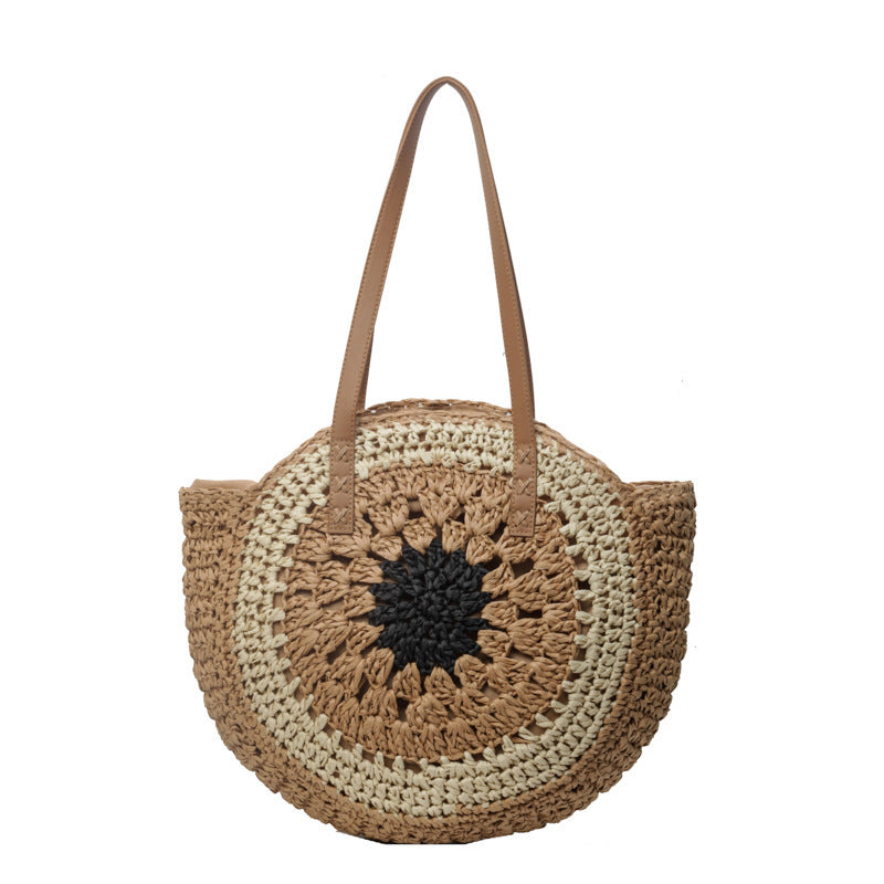 Round woven bag with a sunflower design on a white background