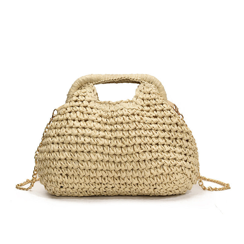 Beige woven handbag with a gold chain on a white background