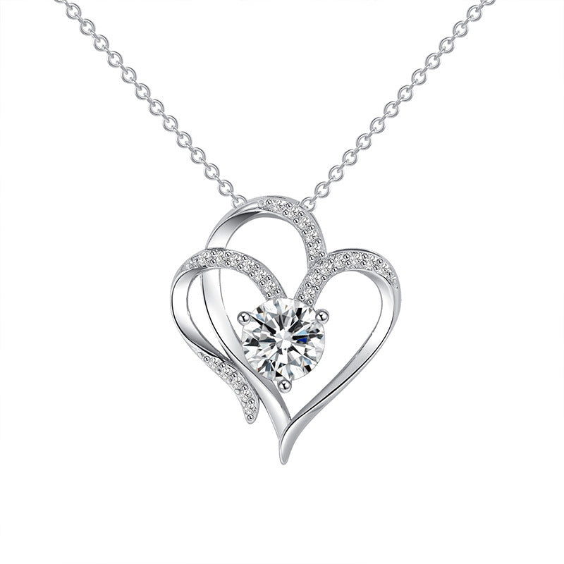 Heart-shaped diamond necklace on a white background