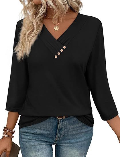 Black long-sleeve top with button details worn by a person, on a white background