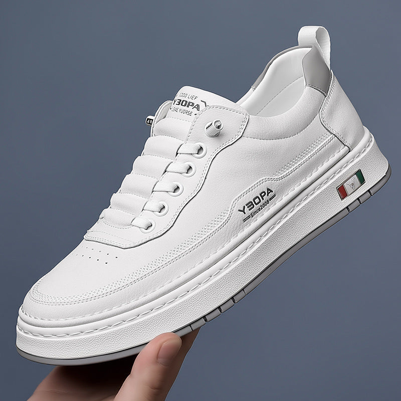 White sneaker with brand logo held against a dark background