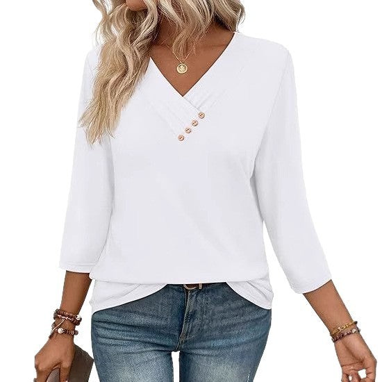 White long-sleeve top with button details worn by a person, on a white background
