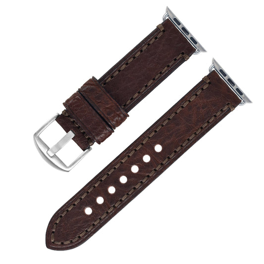 Brown leather watch strap with silver buckle on a white background