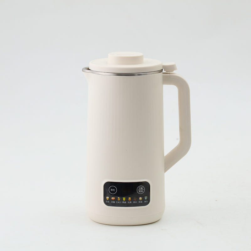 White electric soy milk maker with lid, handle, and front control panel