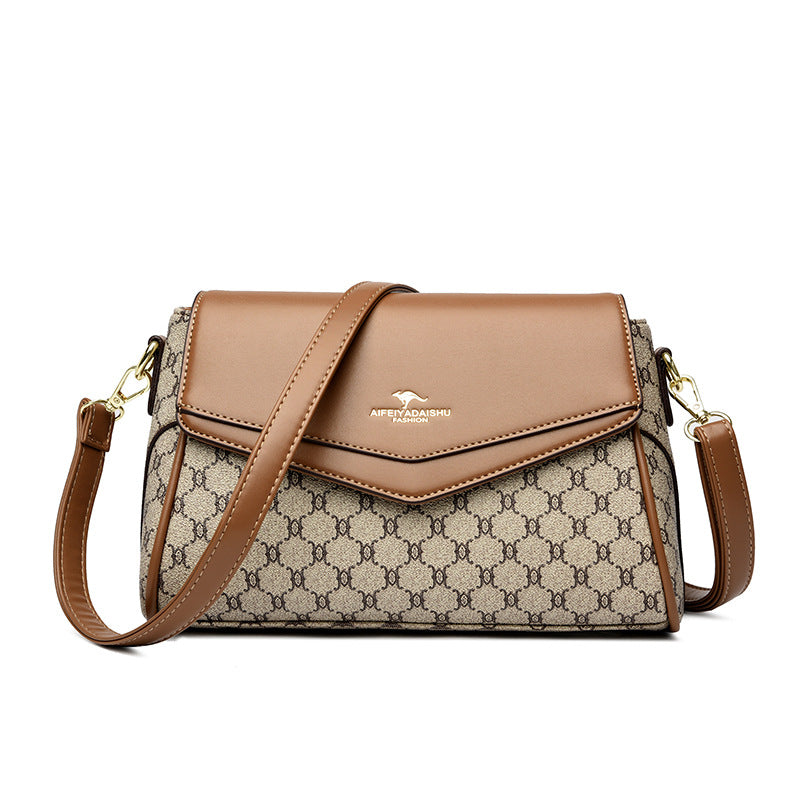 Brown and beige patterned handbag with a visible brand logo on a white background