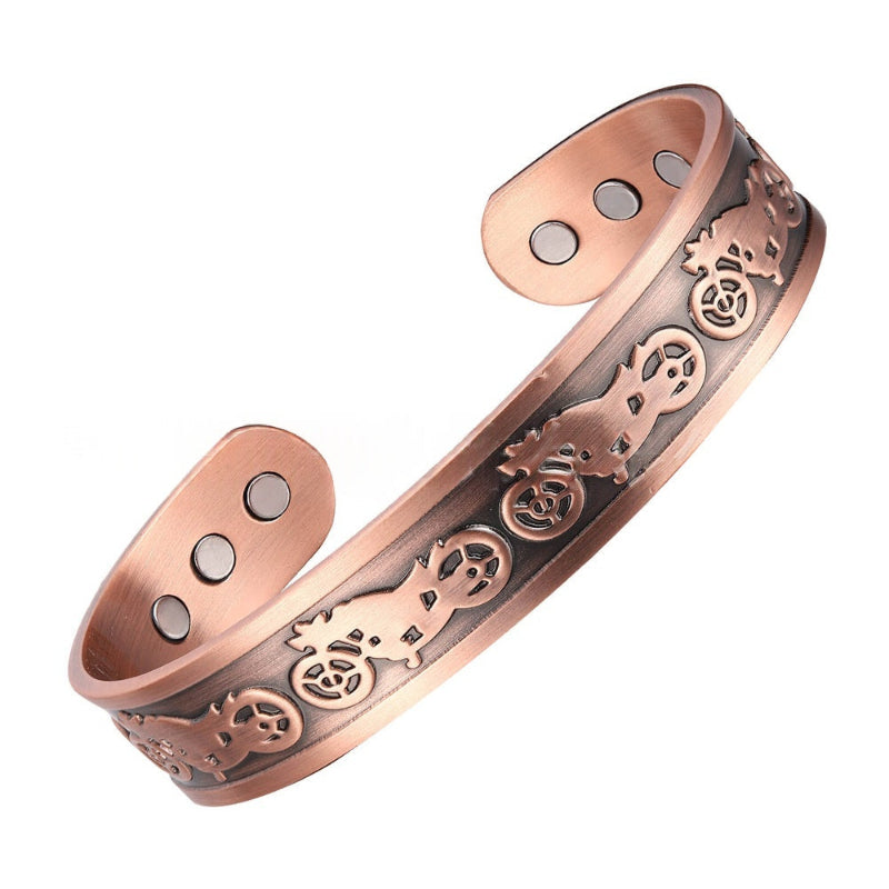 Copper-tone magnetic bracelet with engraved scrolling icons and three round snap points