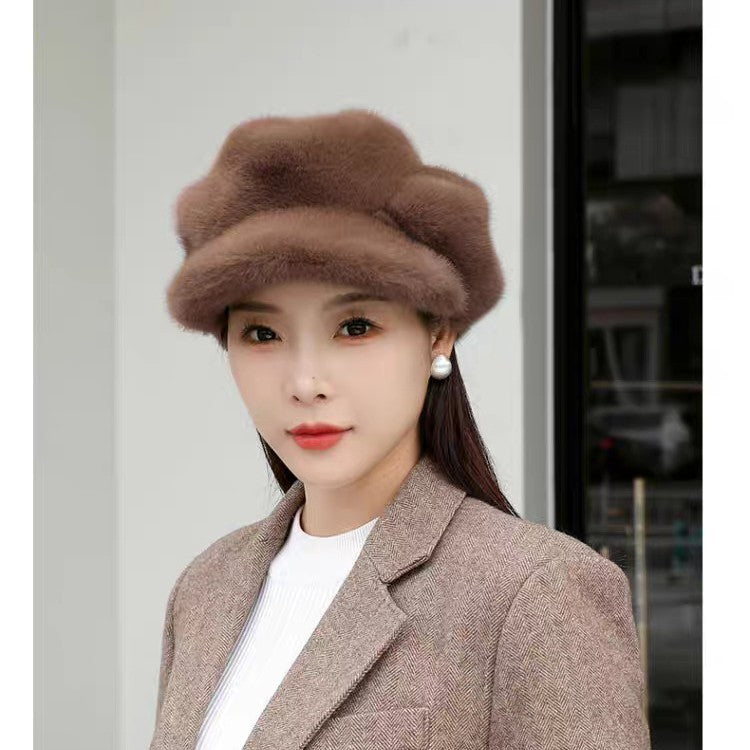 Brown faux fur cloche hat with curled crown; pearl drop earrings