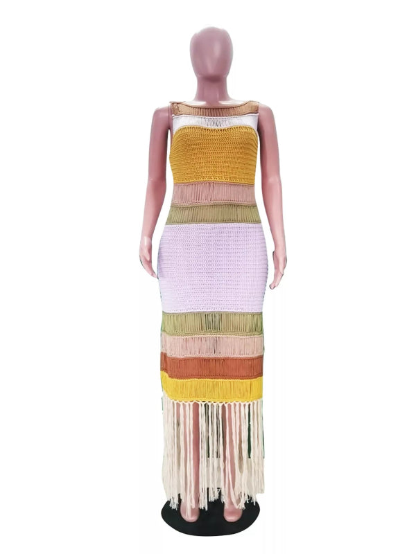Mannequin wearing a colorful striped dress with fringe on a white background