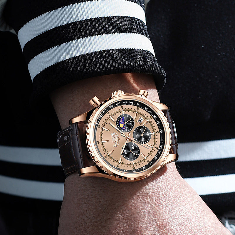 Luxury watch on a wrist with a black and white striped sleeve