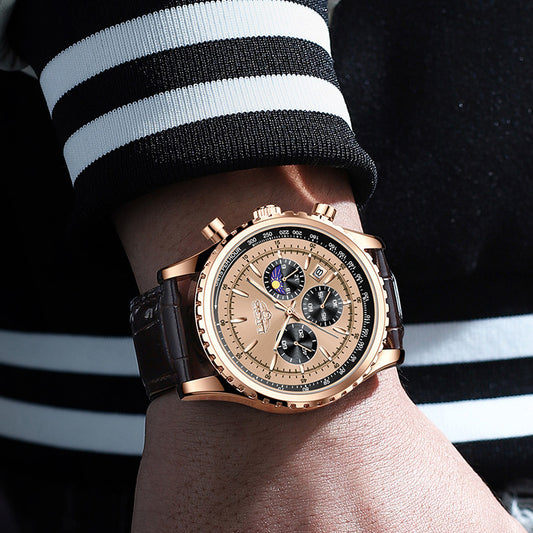 Luxury watch on a wrist with a black and white striped sleeve