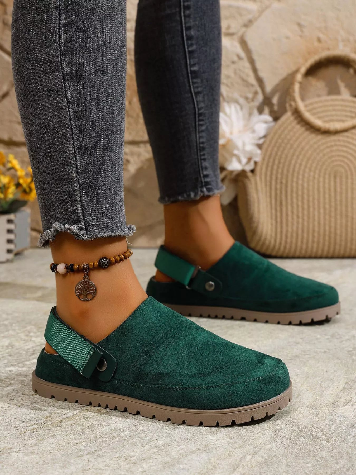 Green suede-like round-toe slip-on flats with side strap and grippy outsole